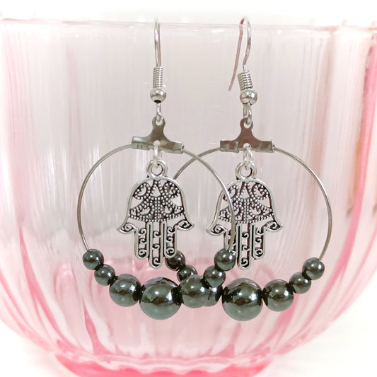 Korvikset hematiitti